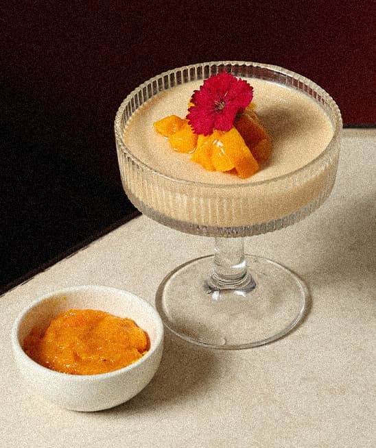 Panna cotta dessert plated with fresh mint